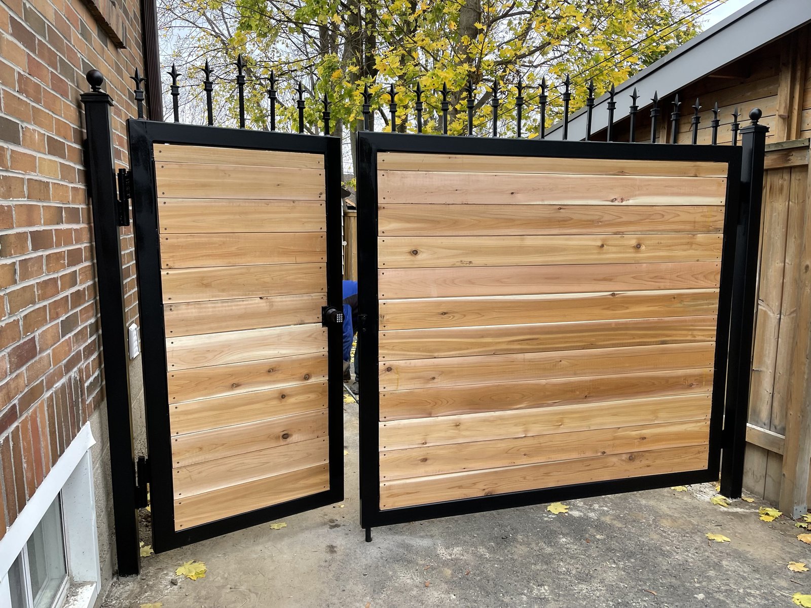 Cedar driveway gates on steel frames with keypad entry